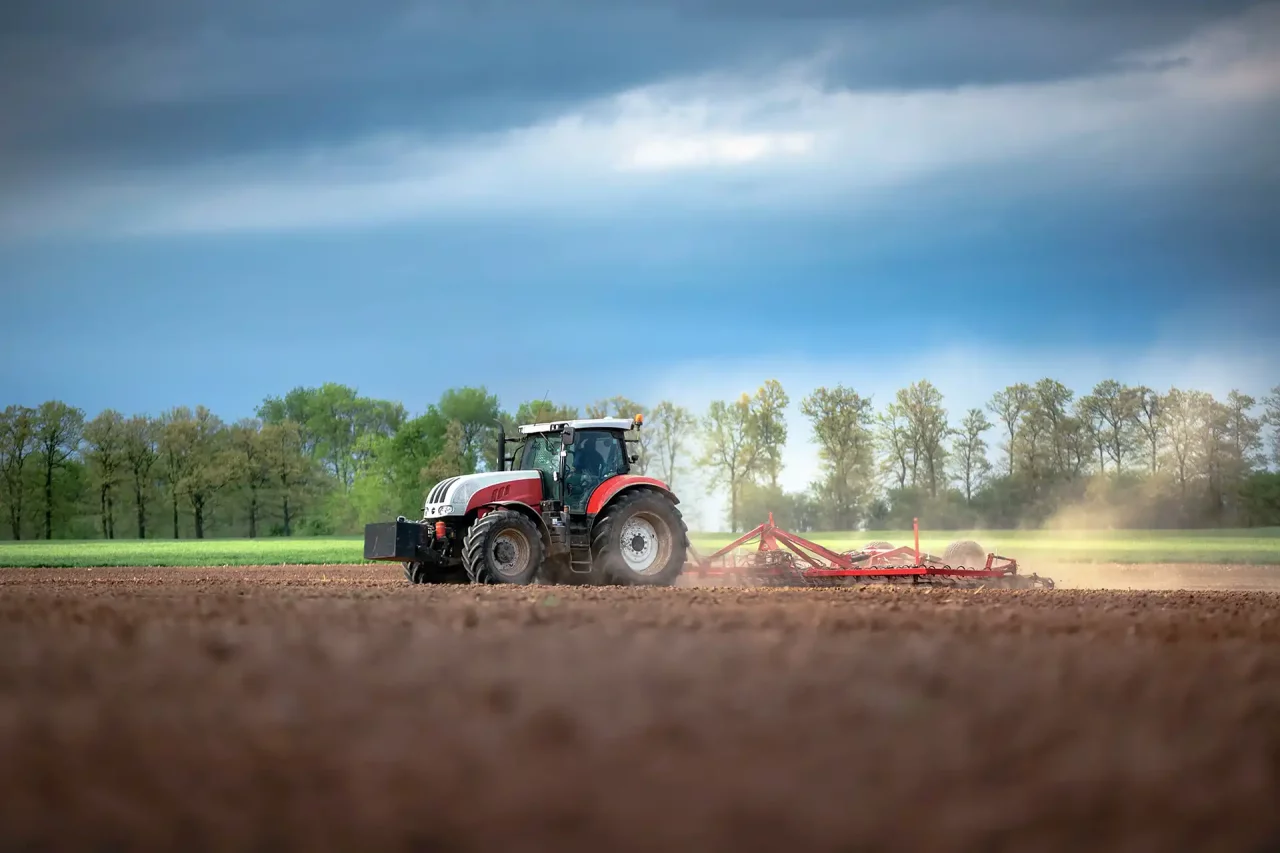tractor driving on land.